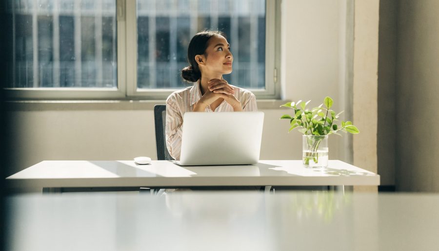 A woman resting her eyes with a screen break